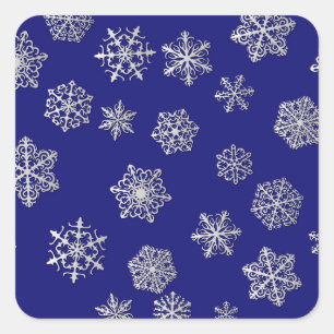 Silver snowflakes on a dark blue background square sticker