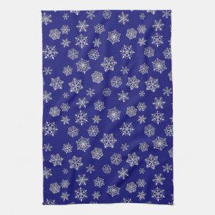 Silver snowflakes on a dark blue background tea towel