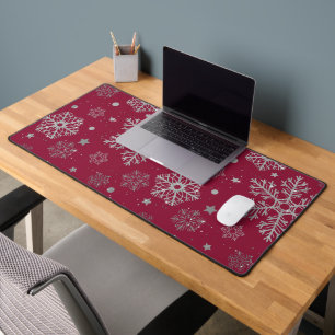 Silver snowflakes on dark red desk mat