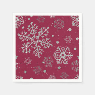 Silver snowflakes on dark red napkin