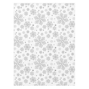 Silver snowflakes on white tablecloth