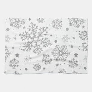 Silver snowflakes on white tea towel