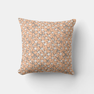 Silver stars on peach pink cushion