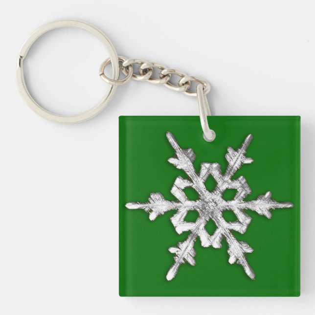 Silver & white snowflake on pine green key ring (Front)
