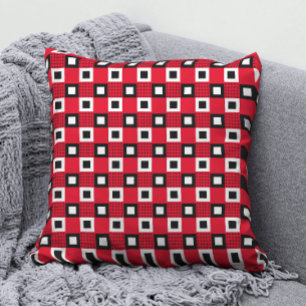 Simple black and white geometric pattern on red cushion