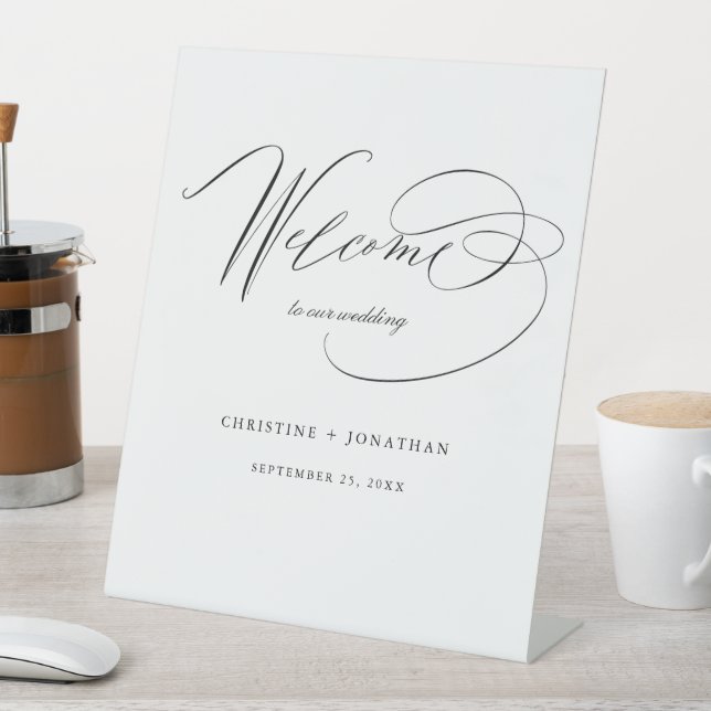 Simple Black White Modern Script Wedding Welcome Pedestal Sign (In SItu)