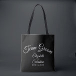 Simple Black & White Team Groom Wedding Tote Bag<br><div class="desc">These "team groom" tote bags are designed as favors or gifts for groomsmen,  family,  or other members of the wedding party. Great swag bag to fill with favors and gifts. Simple design includes white script text over a black background.</div>