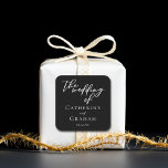 Simple Black White Typography Chic Winter Wedding Square Sticker<br><div class="desc">Simply chic and stylish,  our minimalist winter wedding collection features elegant cursive typography for your modern event. Impress your guests with this bold evening wedding mailing accessory or party favour seal with simple white script The Wedding Of above the couple's names and wedding date.</div>