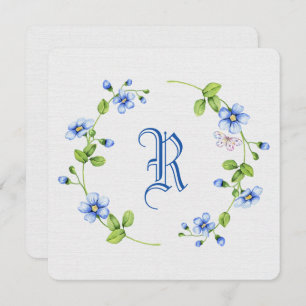 simple blue floral wreath with monogram invitation
