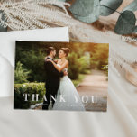 simple bold text wedding thank you card<br><div class="desc">an elegant yet simple white text design with a bold text look and a lovely image of the bride and groom,  the text and colours can be personalised.</div>