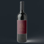 Simple Elegant Christmas Red Wedding Wine Label<br><div class="desc">This simple elegant Christmas red wedding wine label is perfect for your minimalist modern winter wedding. The classic gold luxury calligraphy, along with the traditional red background, all bordered with a minimal frame, is sure to complete the colourful holiday vibe you're looking for. You can personalise with your own photos...</div>