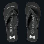 Simple Fun Groomsman Name & Bow Tie Wedding Flip Flops<br><div class="desc">These fun flip flops are a great way to thank the groomsmen at your wedding, and a wonderful way to give his feet a break after a long day! They feature a simple white on black design with his name at the top, the word "Groomsman" spelled out in classy letters...</div>