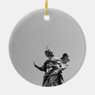 Simple, modern photo of seagull on top of statue ceramic tree decoration