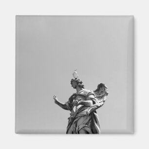 Simple, modern photo of seagull on top of statue magnet