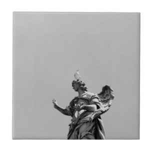 Simple, modern photo of seagull on top of statue tile