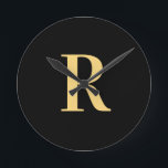 Simple Monogram Modern Black Gold Round Clock<br><div class="desc">This is a simple, modern, personalised monogram design. This stylish design is in trending black and gold with stylish typography. It's perfect for a personalised gift or ideal as a stylish new home decor accessory for yourself. Simply add your initial letter by typing it into the personalise this text box....</div>