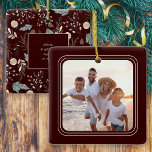 Simple Photo Boho Winter Greenery Christmas Ceramic Ornament<br><div class="desc">This simple family photo Christmas ornament offers space for a square photo against a dark burgundy background. The backside features a boho winter greenery pattern appearing in soft tans and teals on the same dark burgundy background and offers custom text for your name and year.</div>