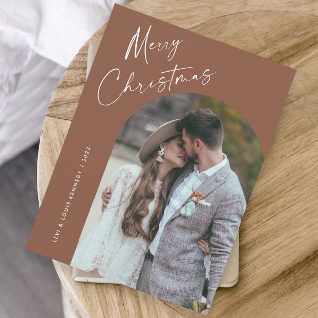 Simple Script Boho Arch Christmas Holiday Card (Simple script boho arch photo Christmas holiday card with modern elegant handwritten typography.)