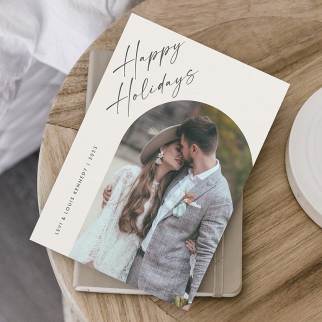 Simple Script Boho Arch Happy  Holiday Card (A modern script photo happy holiday card with boho arch and minimalist typographic layout.)