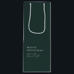 Simple Text Merry Christmas Name Green Wine Gift Bag<br><div class="desc">Simple Text Merry Christmas Name White on Dark Green. Classy simple elegance,  where less is more. The words are stylishly small and understated but the message still loud and clear with your Christmas greeting and names. Fully customisable.</div>