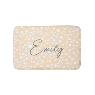 Simple white dotted pattern on peach background bath mat