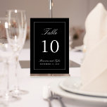 Simply Elegant Wedding Table Number Card<br><div class="desc">A simple elegant table number design in classic black with white text. The easy-to-use text template has the table number along with the Bride and Groom's names and wedding date. To create a table number card for each of your tables, edit the table number along with the names and date,...</div>