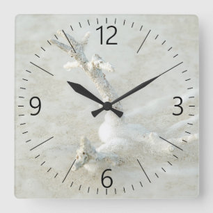 Single coral on the beach square wall clock