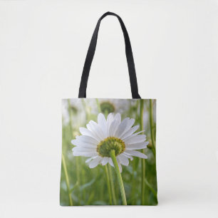 single white daisy in field tote bag
