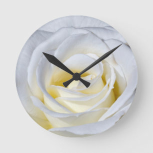 Single white rose blossoms round clock