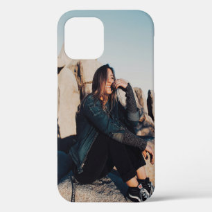 Sitting and smiling woman wearing black pants iPhone 12 case