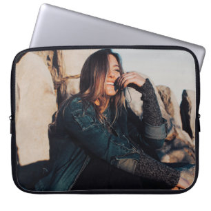 Sitting and smiling woman wearing black pants laptop sleeve