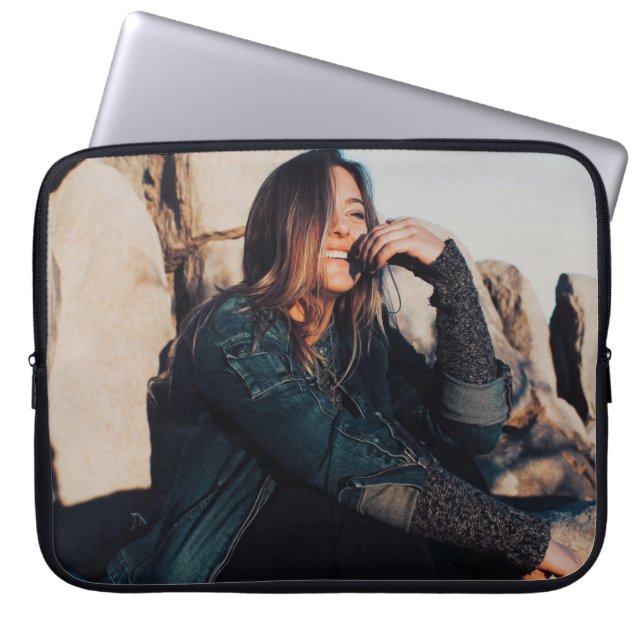 Sitting and smiling woman wearing black pants laptop sleeve (Front)