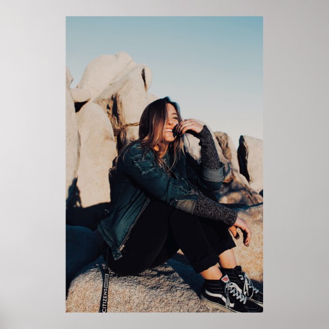Sitting and smiling woman wearing black pants poster (Front)