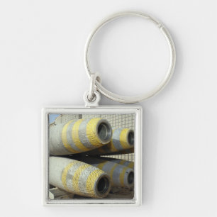 Six GBU-12 bombs sit in a rack Key Ring