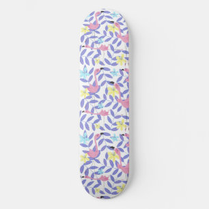 Skateboard with pink flamingo print and tropical s