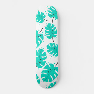 Skateboard with tropical leaves.