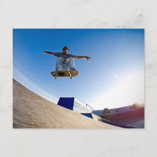 Skateboarder flying postcard