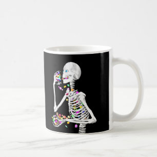 Skeleton Eating Halloween Candy Coffee Mug