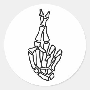 Skeleton hand with crossed fingers classic round sticker