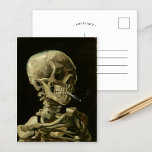 Skeleton with Burning Cigarette | Vincent van Gogh Postcard<br><div class="desc">Skull of a Skeleton with Burning Cigarette (1886) by Vincent van Gogh is a striking and unconventional still-life painting that features a human skull with a lit cigarette between its teeth. The dark background enhances the starkness of the skeletal figure, while the small plume of smoke adds a sense of...</div>