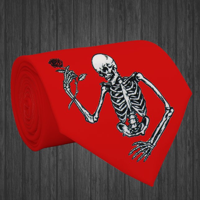 Skeleton With Rose Tie (Gothic skeleton holding single red rose on stem on vibrant red neck tie.)