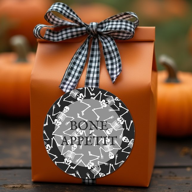 Skeletons BONE APPÉTIT Classic Round Sticker (Skeletons on black round stickers feature the wording BONE APPÉTIT)