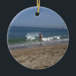 Skimboarder Success Ceramic Tree Decoration<br><div class="desc">A mixture of balance,  muscle tone and fearlessness is required to try this difficult sport of skimboarding. This young fellow made it look (almost) easy.</div>