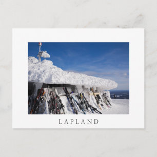 Skis in a ski resort, Lapland white text postcard