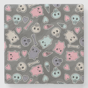 Skulls, and hearts on black background stone coaster