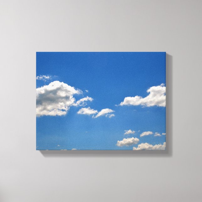 Sky is blue and white clouds are passing by canvas print (Front)