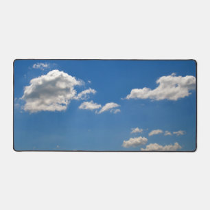 Sky is blue and white clouds are passing by  desk mat