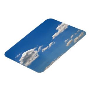 Sky is blue and white clouds are passing by magnet