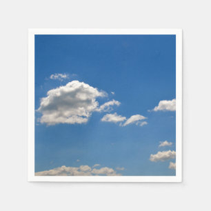 Sky is blue and white clouds are passing by napkin
