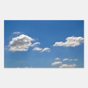 Sky is blue and white clouds are passing by rectangular sticker
